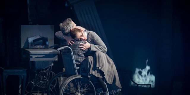 Cinderella (Cordelia Braithwaite) hugging Robert, her father (Alan Vincent) in Matthew Bourne's Cinderella