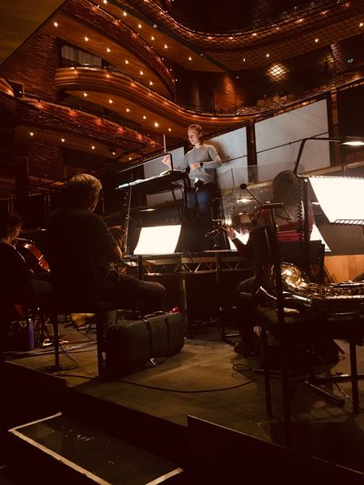 Ellie Slorach leading a Romeo and Juliet Orchestra Rehearsal