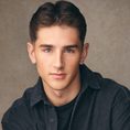 White male with brown hair wearing black shirt