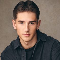White male with brown hair wearing black shirt