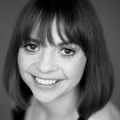 headshot of woman with short bobbed hair and fringe