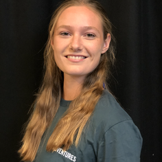 A Cornish/European woman with long, light-brown hair, smiling to camera