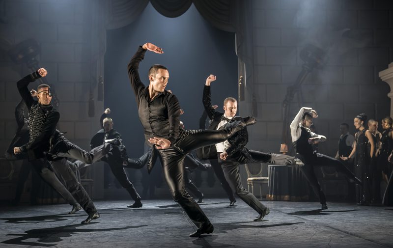The Stranger (Will Bozier) and Escorts at The Royal Ball in Matthew Bourne's Swan Lake