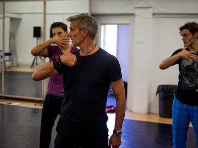 Adam Cooper (Original Swan / Stranger) mentoring the Swans in rehearsals
