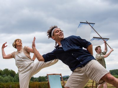 Dancers make shapes with windy ship sails