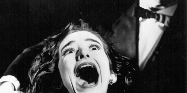 A 1992 black and white photograph of Etta Murfitt screaming in Deadly Serious